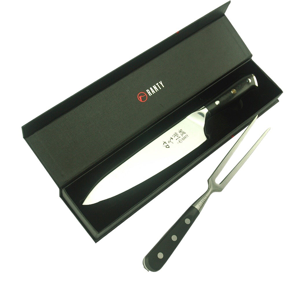 Tenedor trinchador Grand Chef Ranty con cuchillo acero de damasco Grand Chef en caja de presentación negra y elegante.