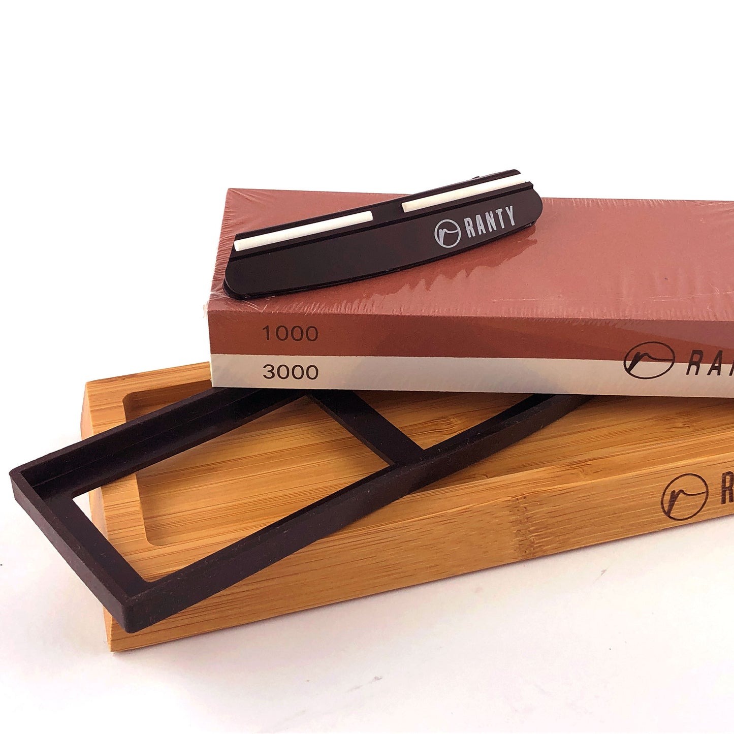 Kit afilador cuchillo piedra húmeda Ranty con soporte ajustable y piedra doble cara.