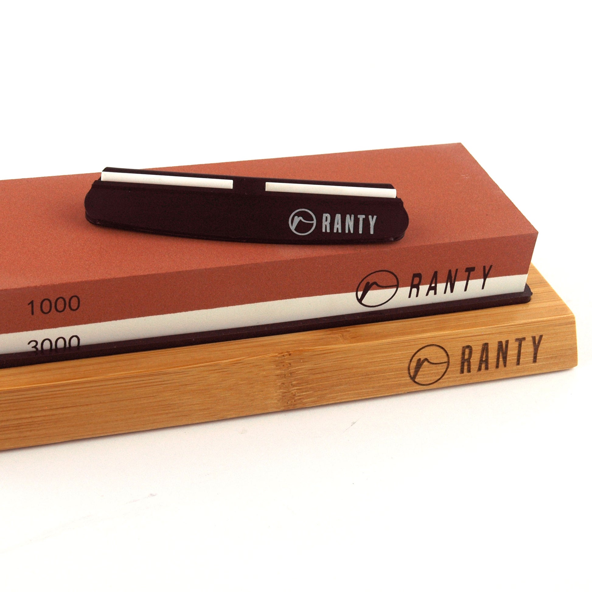 Kit afilador cuchillo piedra húmeda Ranty con base de madera de silicón antideslizante.